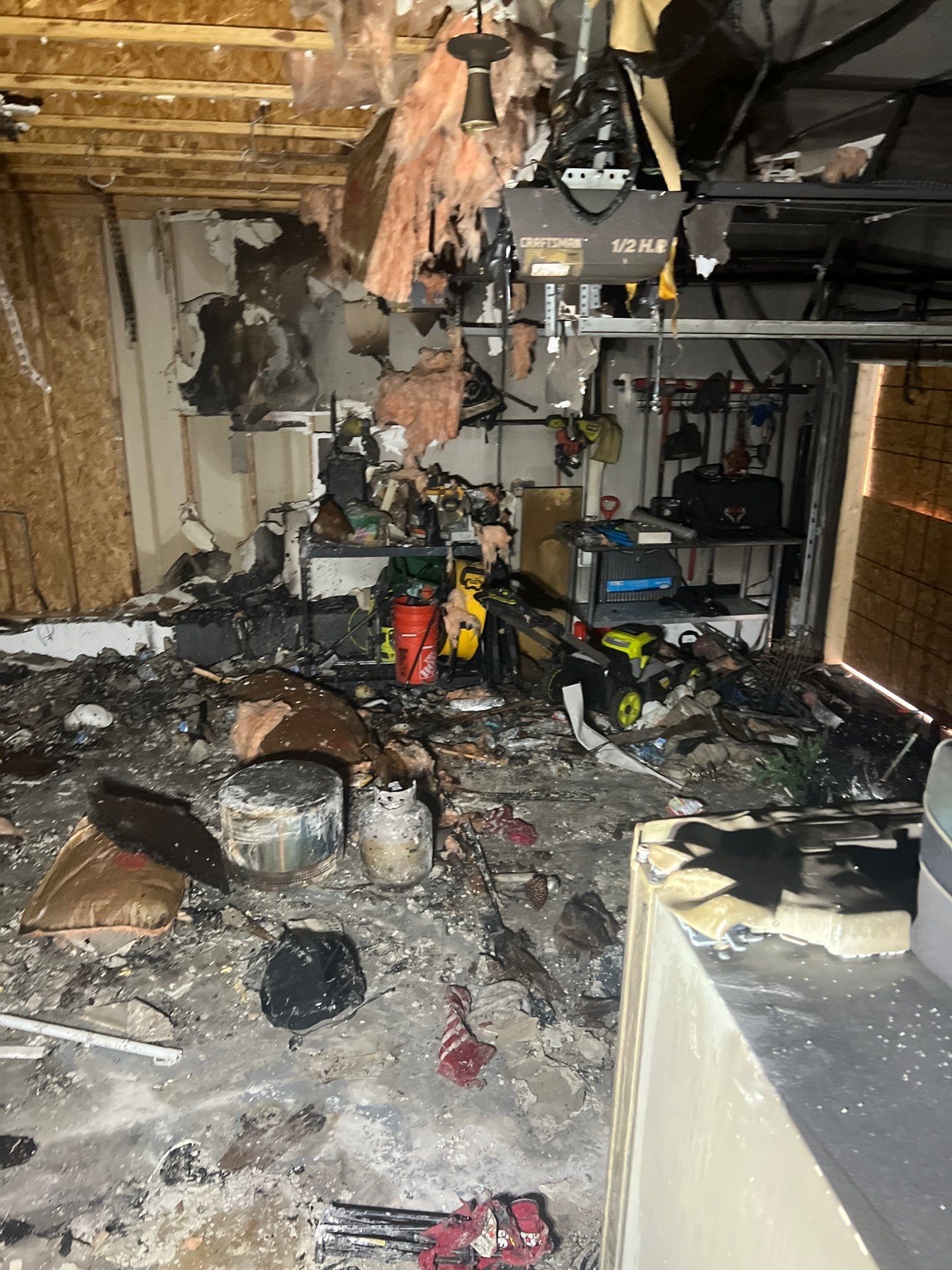 Extensive fire damage inside a Salt Lake City garage cleared by IRS crew