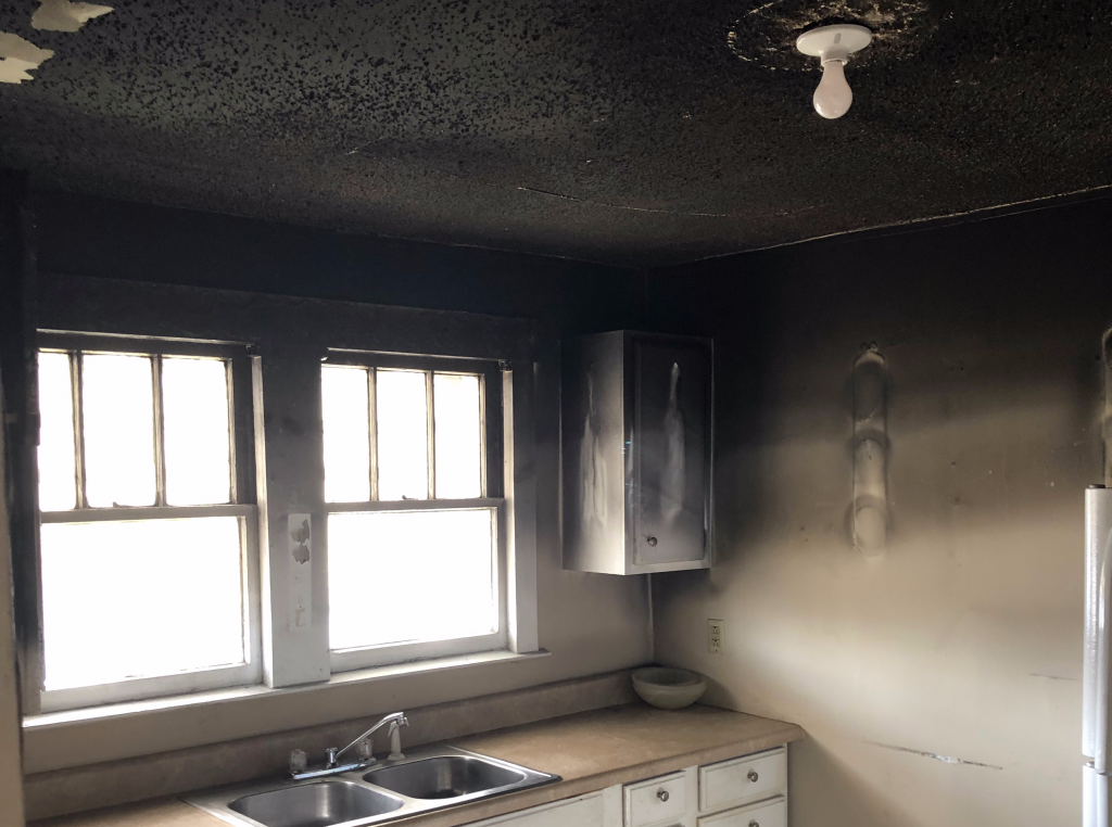 Heavy smoke and soot damage in a Salt Lake City kitchen after a fire