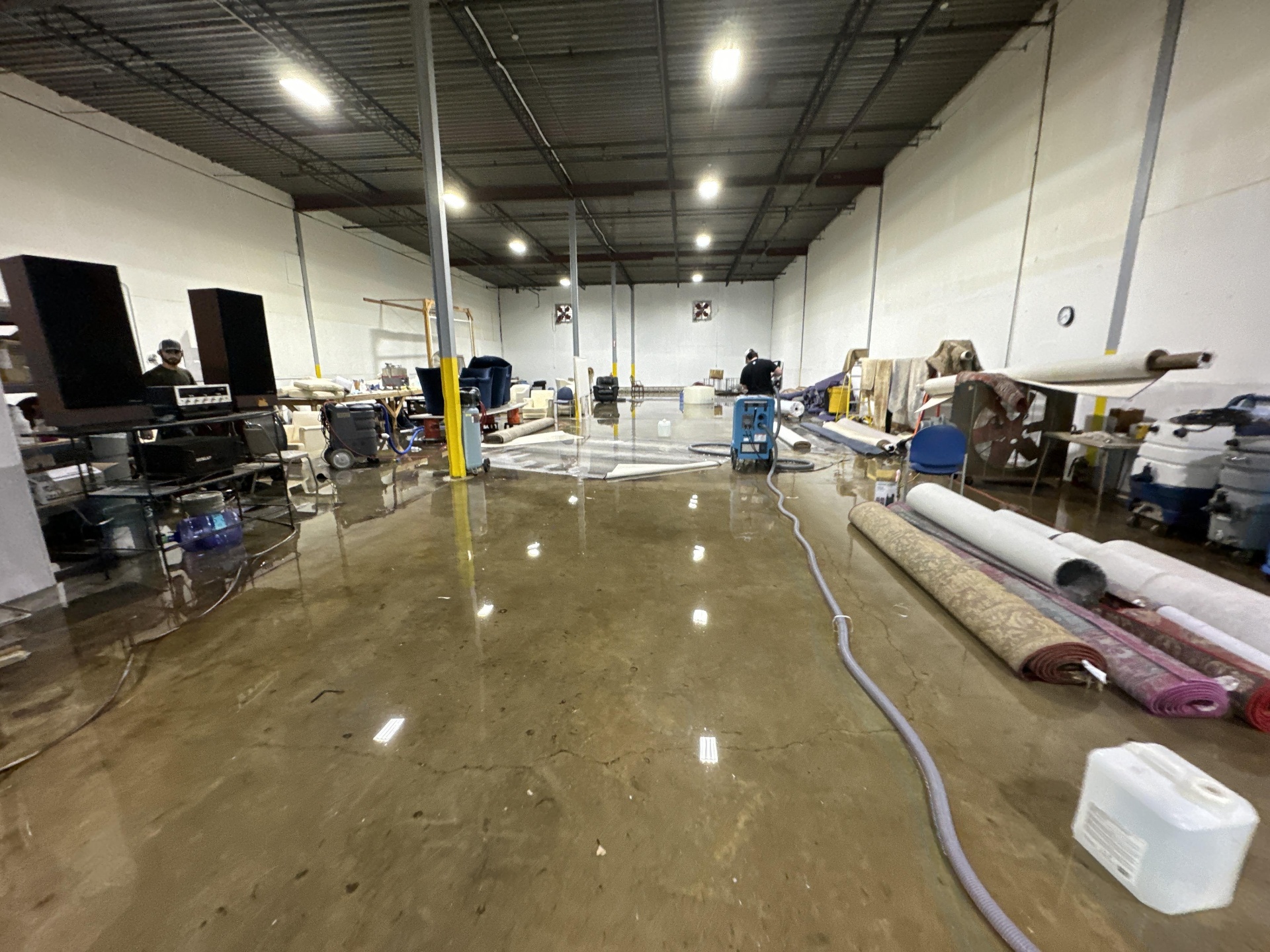 Flooded warehouse contents being assessed by IRS crew
